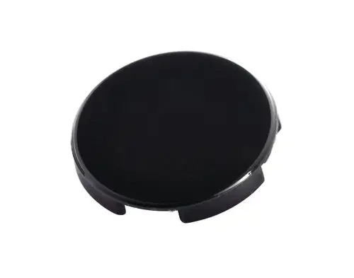 Schwarze Kappe mit kreisförmigem Design und Aussparungen, produziert von Ideal Standard. Das Produkt könnte als Verschluss oder Abdeckung verwendet werden.